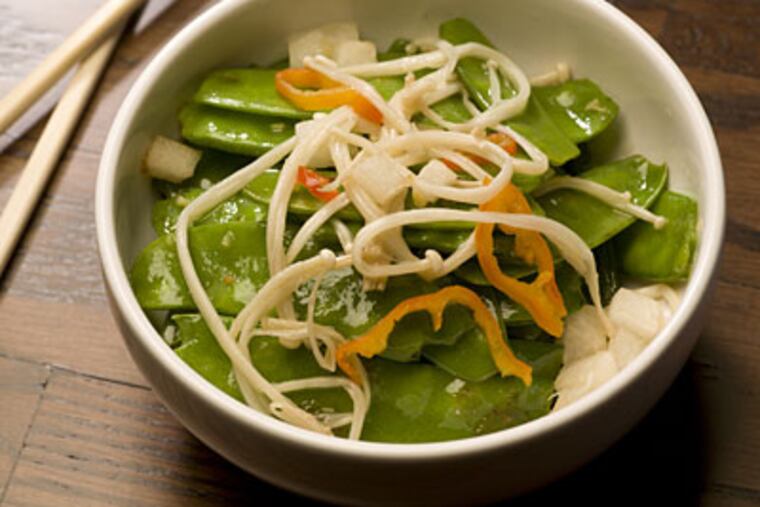 Celebrate the Year of the Tiger by cooking her Charred Snow Peas, Pickled Mushrooms, and Water Chestnuts. (ED HILLE / Staff Photographer)