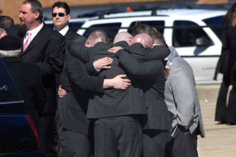 Mourners console one another outside St. Gabriel's Church in Norwood after Vanessa Dorwart's funeral. "Thank you, dear sister, I'll love you till the end," her sister Francine, 17, wrote in a poem.
