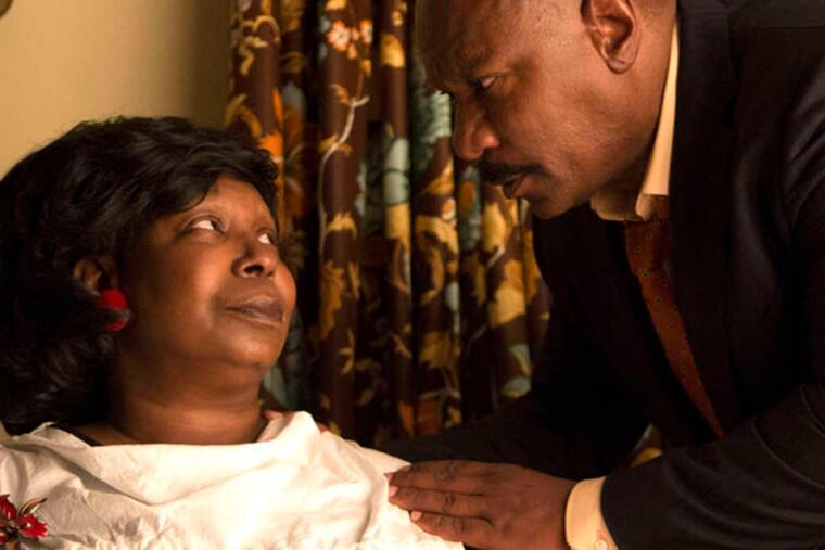 Whoopi Goldberg with Ving Rhames, as her estranged husband., in a scene from Lifetime’s “A Day Late and a Dollar Short”