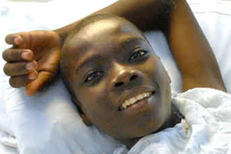 Netus Madiode survived the Haitian earthquake that killed his parents, but tuberculosis had caused spinal disfigurement that threatened early death. (April Saul / Staff Photographer)