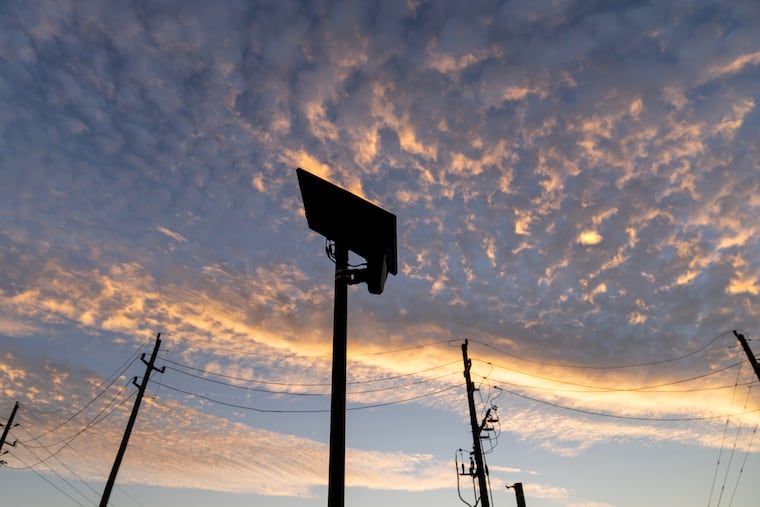 A Flock Safety license plate reader is seen along a public road in Houston in October.