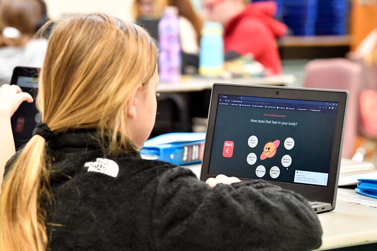A student in Kentucky participates in an emotional check-in at the start of the school day on Aug. 11.
