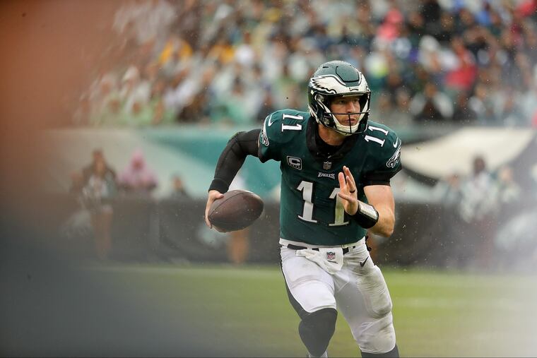 Eagles' Carson Wentz scrambles during the 2nd quarter as the Philadelphia Eagles play the Indianapolis Colts in Philadelphia, PA on September 23, 2018. DAVID MAIALETTI / Staff Photographer