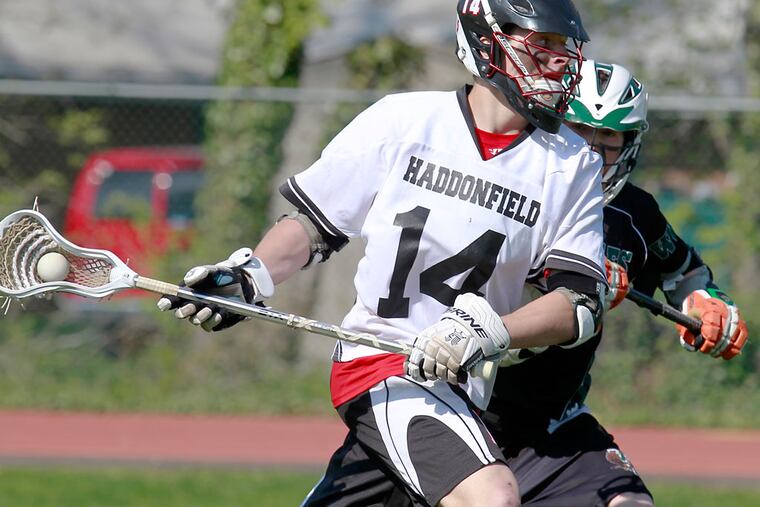 Haddonfield's Gunnar Apgar is chased by West Deptford's Jeff Todd during the third quarter of a boys lacrosse game on Saturday. (Akira Suwa/ Staff Photographer)