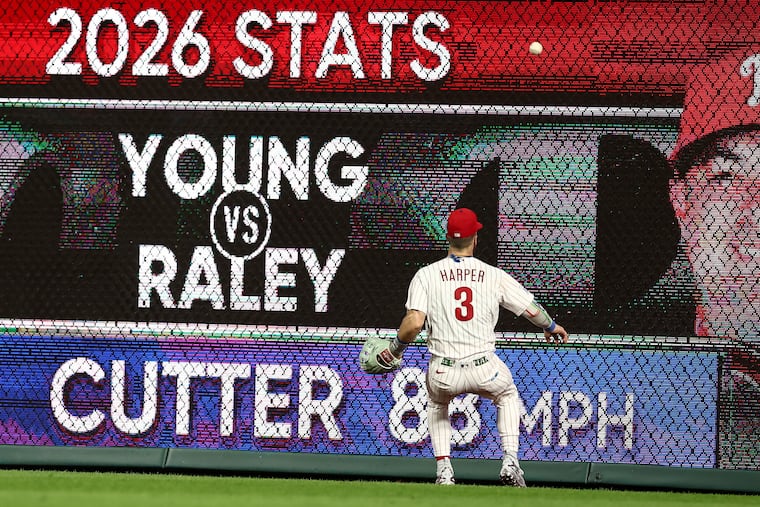 Bryce Harper chases down a double during the seventh inning of Wednesday's game. He has played five games in the outfield since the Phillies traded for Luis Arraez.