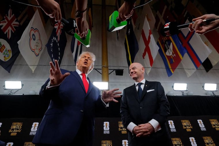 FIFA President Gianni Infantino and President Donald Trump speak to the media as they arrive on the red carpet ahead of the FIFA World Cup 2026 Final Draw at the John F. Kennedy Center for the Performing Arts.