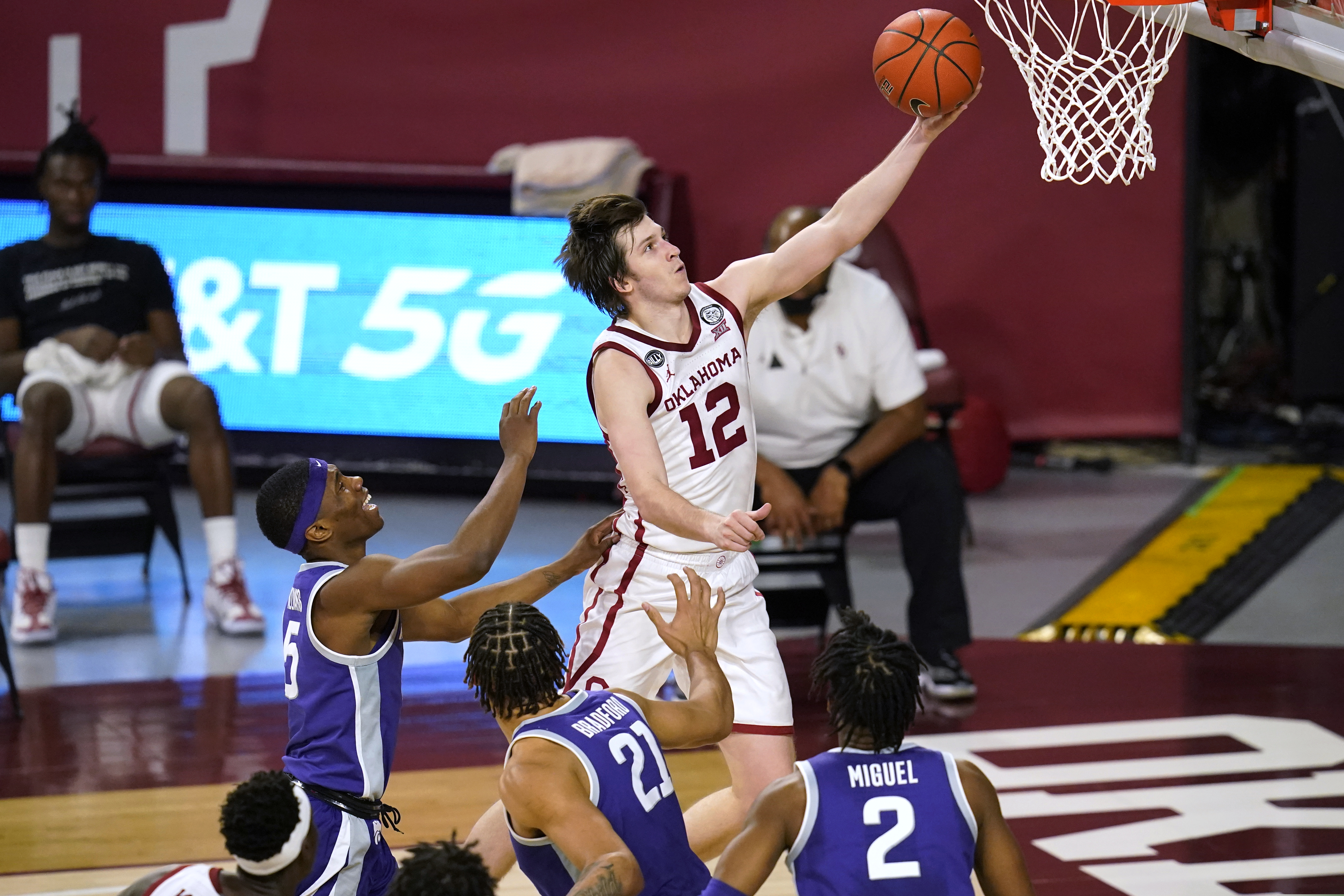 Oklahoma guard Austin Reaves goes to the basket in front of Kansas State guard Rudi Williams, forward Davion Bradford and guard Selton Miguel during an NCAA game Tuesday, Jan. 19, 2021, in Norman, Okla.