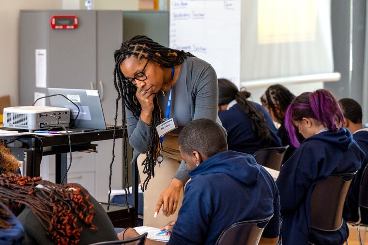 Teacher Blair Allen works with students in her Introduction to Theatre class at Camden Prep High School. The school of 350 students (grades 9-12) are in their first full week of classes in the newest built-from-the-ground-up school building in the Uncommon Schools network.