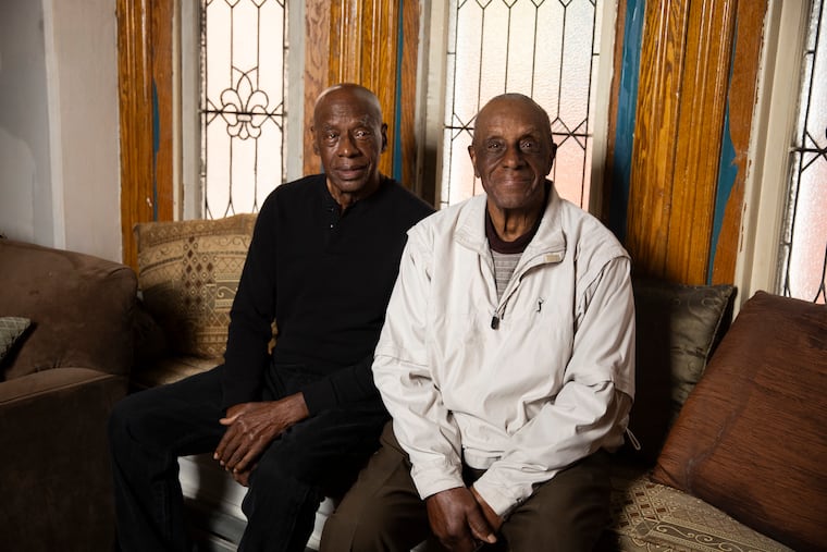 Brothers Lou and Arlington Henderson posed for a portrait at Arlington’s home in West Philadelphia on Thursday, May 16, 2024. They are among a few dozen elderly Black ballplayers who will be honored June 20 at the MLB Negro Leagues tribute game at Rickwood Field in Birmingham, Ala.