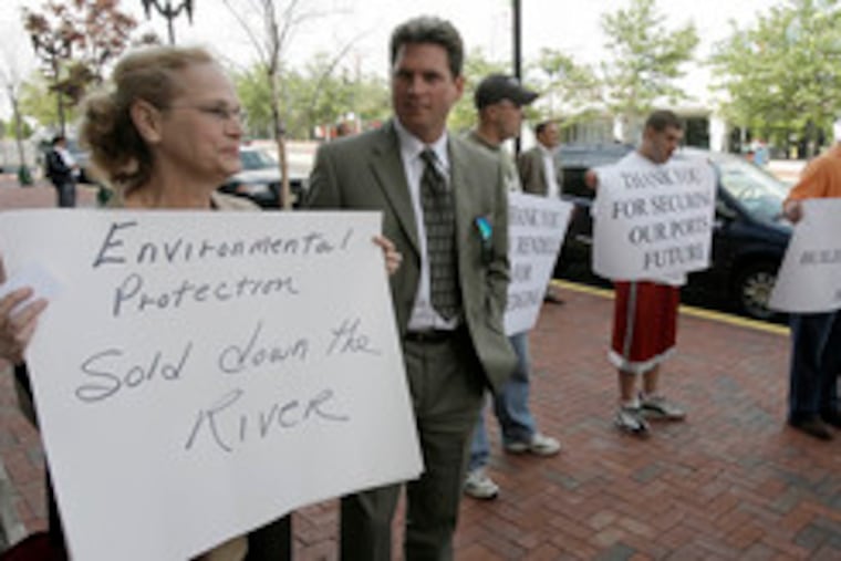 The deal brought protests from Sharon Finlayson (left) of the New Jersey Environmental Federation and Tim Dillingham (second from left) of the American Littoral Society and support from, at right, the International Brotherhood of Electrical Workers Union and International Longshoremen's Association.