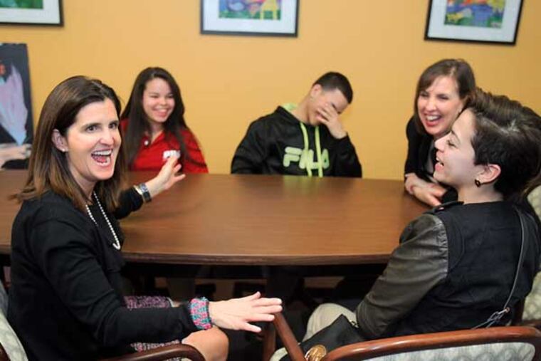 First lady Mary Pat Christie (left) is having fun discussion with students, Estefany Rodriguez, 16 (back left), Manuel Gonzalez,10 and Ashley Gascot,16 (right front). Back right is Jodina Hicks, Executive Dir. of Urban Promise in Camden during the tour at the Urban Promise 03-12-2014( AKIRA SUWA / Staff Photographer )