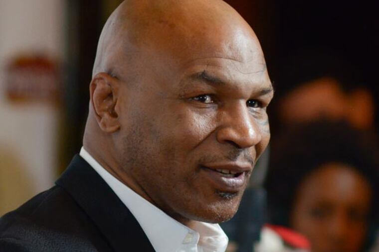 Mike Tyson arrives at the LA premiere of "Mike Tyson: Undisputed Truth" at the Pantages Theatre on Friday, March 8, 2013 in Los Angeles. (Richard Shotwell/AP, Invision)