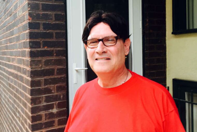 Phil Haberman outside his Center City house, which has been plagued by repeated roof leaks. (Jeff Gelles / STAFF)