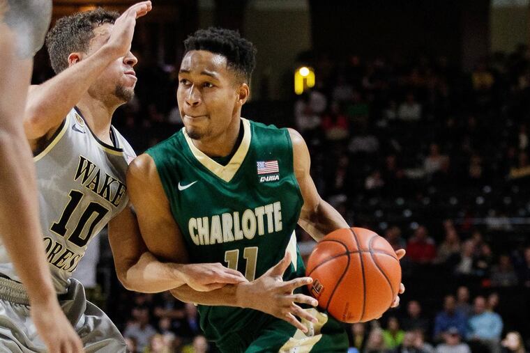 Quentin Jackson (11) of Charlotte driving on Mitchell Wilbekin of Wake Forest in December 2016. Scott Kinser/Cal Sport Media
