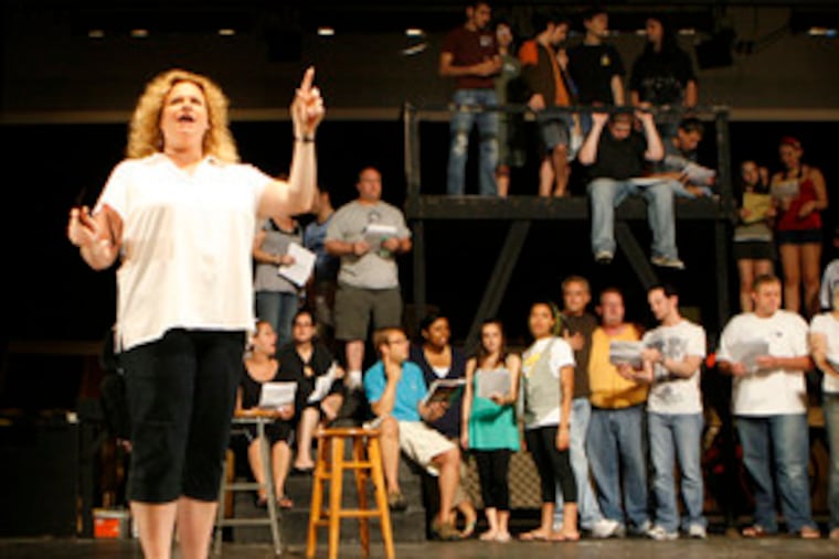 Tami Gordon-Brody , Class of 1982, who is coordinating the show, directs a rehearsal at Cherry Hill High School East.