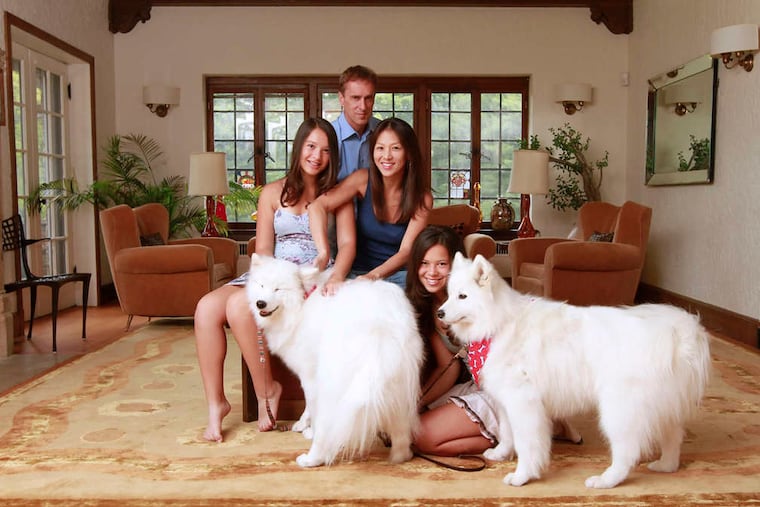 Authors Amy Chua and Jed Rubenfeld at home with daughters Lulu (left) and Sophia and their dogs.