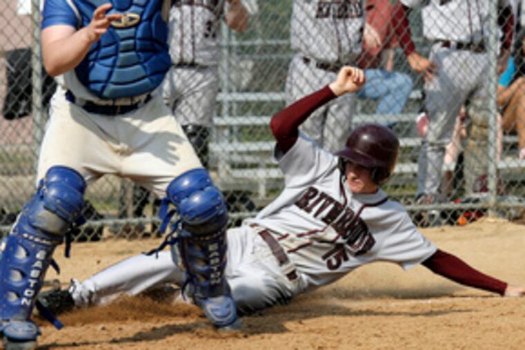 Riverside's Tony Caruso slides safely into home in the third inning behind Burlington City catcher Rich Edge, who awaits the throw. Riverside scored three times in the inning to build a 6-0 lead.