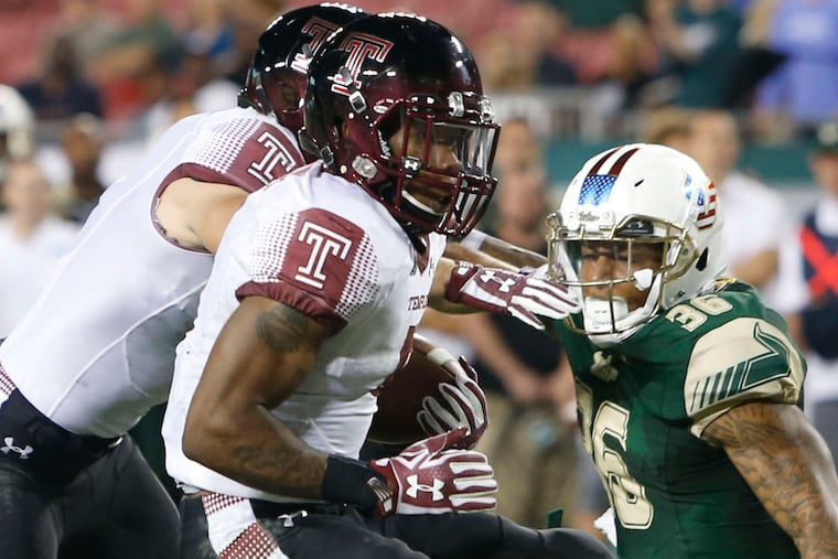 Temple's Jahad Thomas (front) became the 10th back in Owls history to top 1,000 yards for a season.