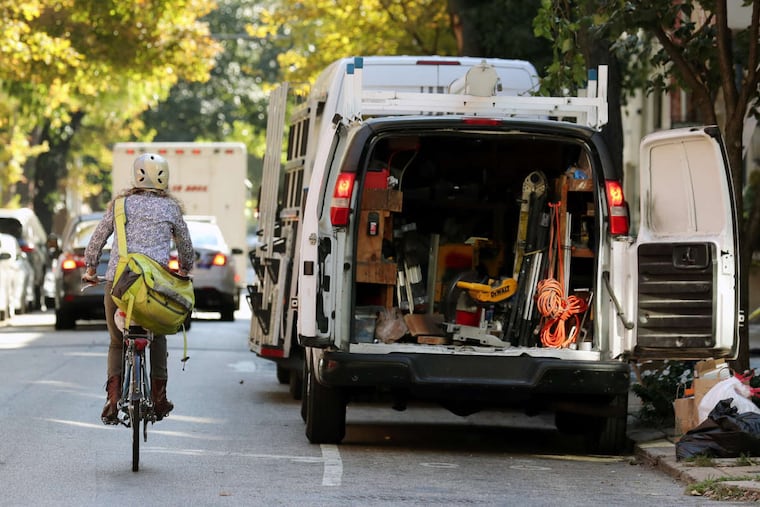 Because bike lanes are often blocked by delivery vans, building contractors, ride-hailing vehicles and resident parking, bicyclists must weave in and out of traffic. Here, Pine Street, between 18th and 22nd. is blocked by a contractor.