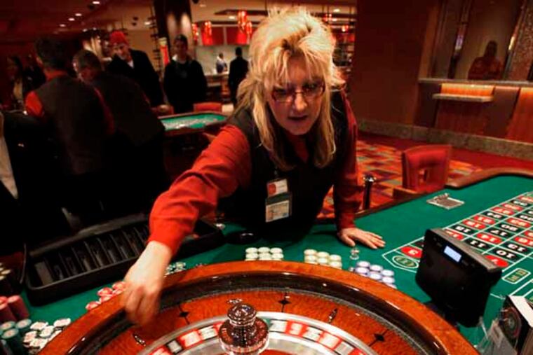 Laureen Jolley spins the roulette wheel in the new Parx East Casino in the old Philly Park building on opening day, December 22. 2010. (Laurence Kesterson / Staff Photographer)