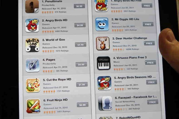 A screen grab from an iPad lists the top apps. A suit contends that Apple customers have lost millions when children have been lured to purchase virtual items to succeed at free games.