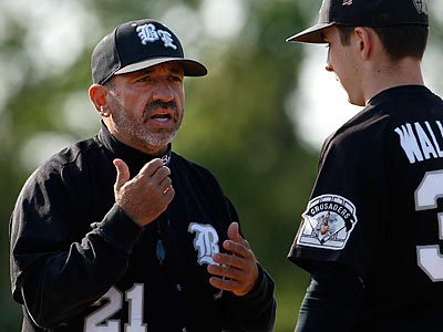 Former Bishop Eustace pitcher Keith Wallace listens to head coach Sam Tropiano.
