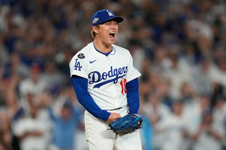 Los Angeles Dodgers pitcher Yoshinobu Yamamoto reacts after striking out Cincinnati Reds' Elly De La Cruz during the sixth inning.