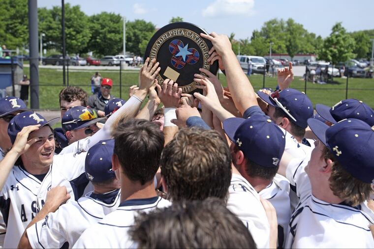La Salle players hold up the Catholic League championship plaque after cruising past Archbishop Carroll, 10-0, in five innings.