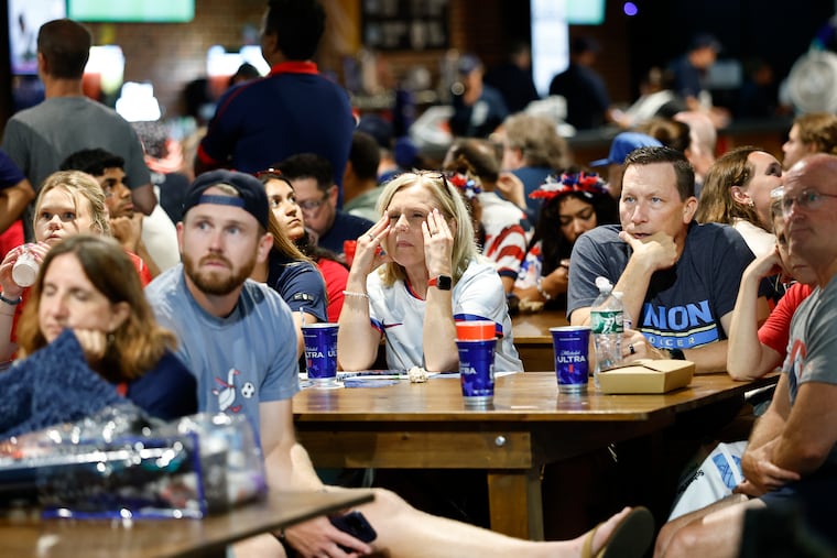 Soccer fans at Union Yards in Chester watch the action between the USMNT and Belgium late in the second half of the teams' round of 16 game on Monday.