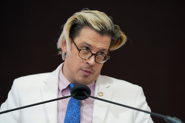 Activist Milo Yiannopoulos speaks during a rally in Baltimore, Nov. 16, 2021. He was arrested in New Orleans Thursday and deported to the U.K. Friday after overstaying his visa.