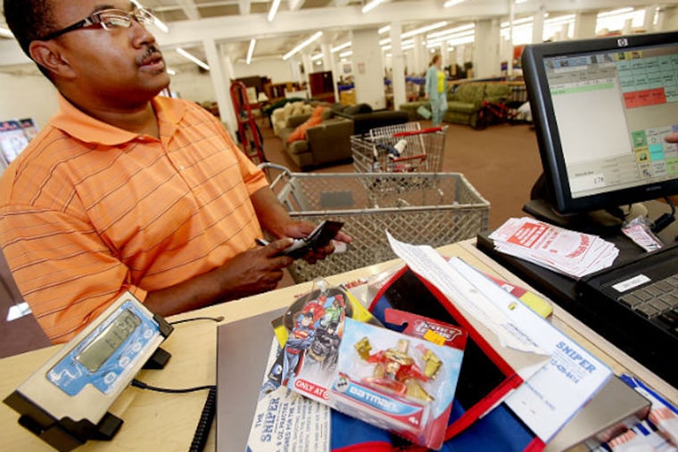 Rodney Lewis takes advantage of a new program at the Salvation Army of selling by the pound in Minneapolis on June 5, 2014. (Joel Koyama / Minneapolis Star Tribune / MCT)