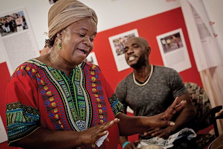 Vocalist Fatu Gayflor of the Liberian Women's Chorus for Change rehearses in the Philadelphia Folklore Project house. The group is in concert on Saturday night at World Cafe Live.