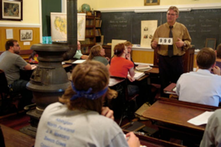 Edward E. Quinter teaches a Pennsylvania Dutch dialect class in a one-room schoolhouse on Kutztown University's campus.A potbellied stove adds to the ambience.