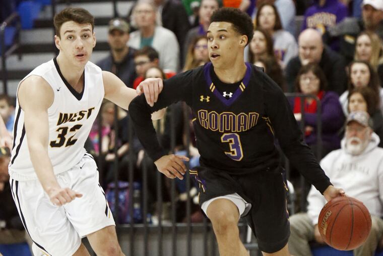 Roman Catholic guard Lynn Greer III drives the baseline against Central Bucks West swingman Collin MacAdams during the third quarter.