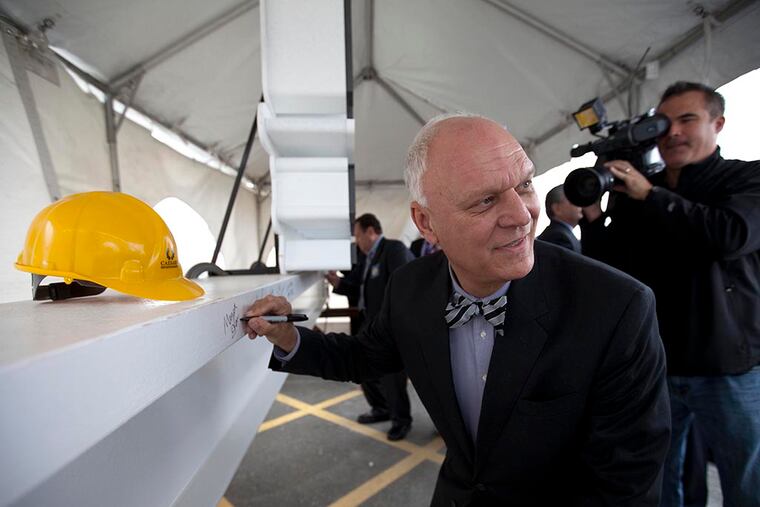 Atlantic City Mayor Don Guardian signs the ceremonial steel beam during the Top Off ceremony for Harrah’s Conference Center in Atlantic City on October 22, 2014. ( DAVID M WARREN / Staff Photographer )