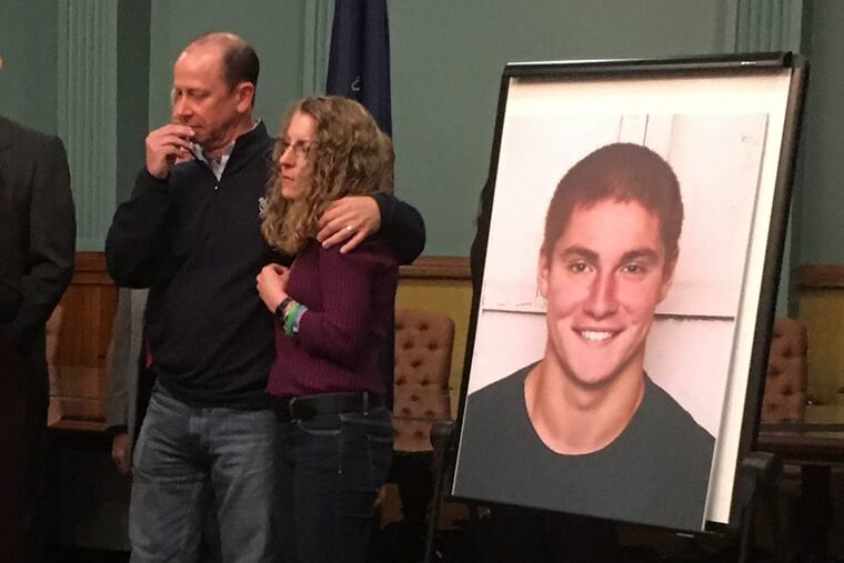 Tim Piazza (in blown-up photo) and Jim and Evelyn Piazza, his parents