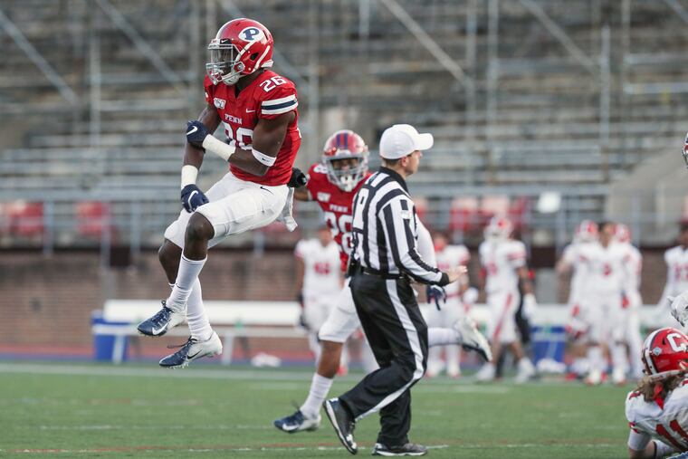 Penn defensive back Kendren Smith (26) celebrates after a stop on a two-point conversion that would have given Cornell the lead late in the fourth quarter.