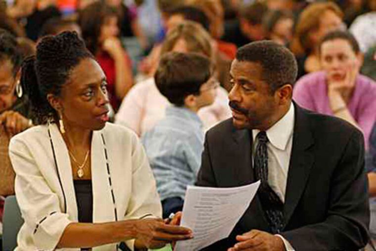 In this May 2009 photo, Ina Walker (left), CEO of New Media Charter School, and Hugh Clark, president of the school's, board of trustees, talk before the commission meeting begins. ( Michael S. Wirtz / Staff Photographer ).