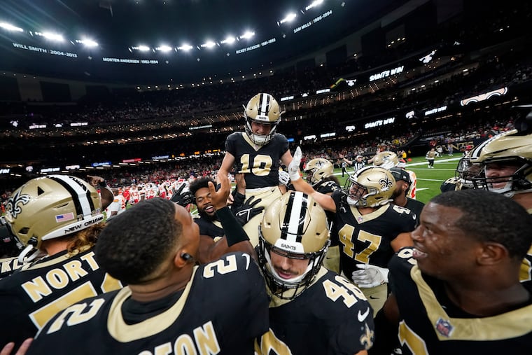 Saints kicker Blake Grupe celebrates with teammates after kicking a game-winning field goal to beat the Chiefs on Sunday.