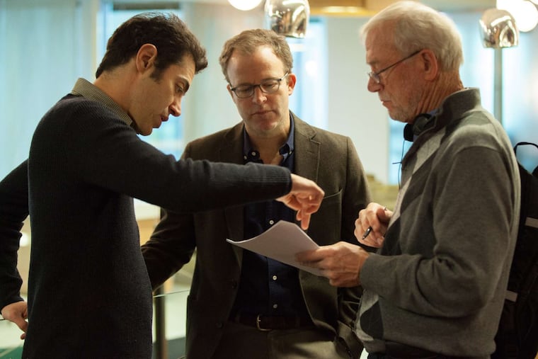 On the set of 'Spotlight,' about the Boston Globe investigation of pedophile priests, (from left) writer Josh Singer, co-writer/director Tom McCarthy, and Globe editor Walter Robinson confer.