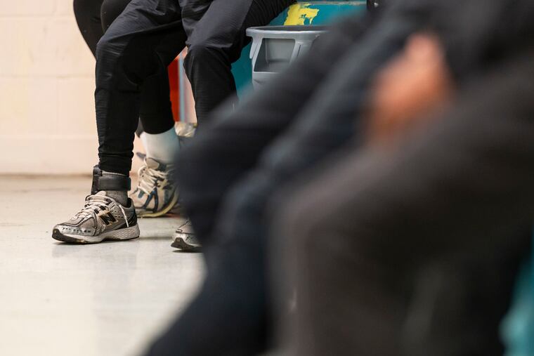 A participant with Next Gen Success wears an ankle monitor at MLK Recreation Center in North Philadelphia.