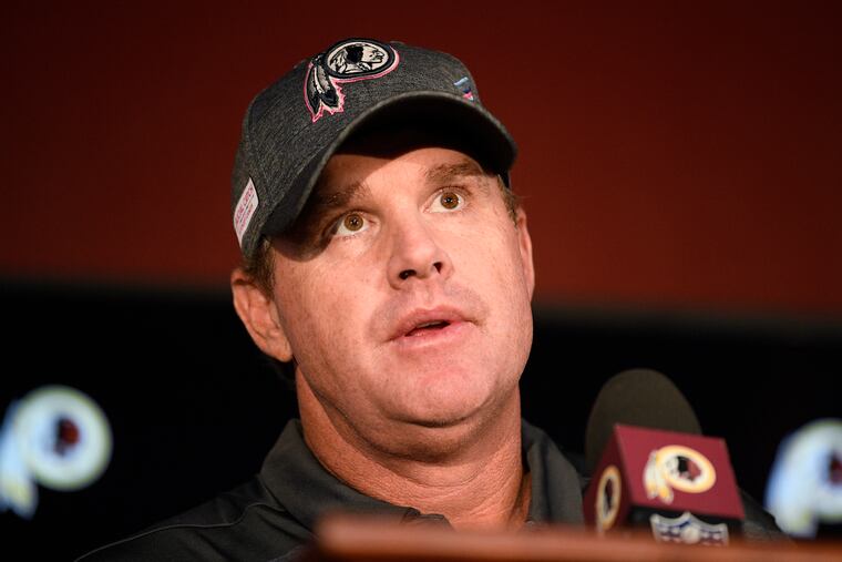 Jay Gruden speaking at a news conference after his final game as Redskins coach.