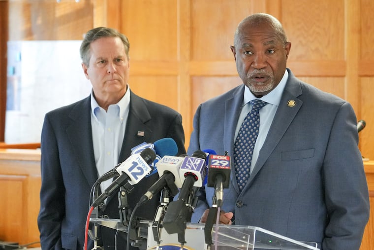 U.S. Reps. Donald Norcross (left) and Herb Conaway Jr. hold a press conference after their visit to Joint Base McGuire-Dix-Lakehurst on Friday. The Trump administration has proposed a plan to use the base as a detention center for undocumented immigrants.