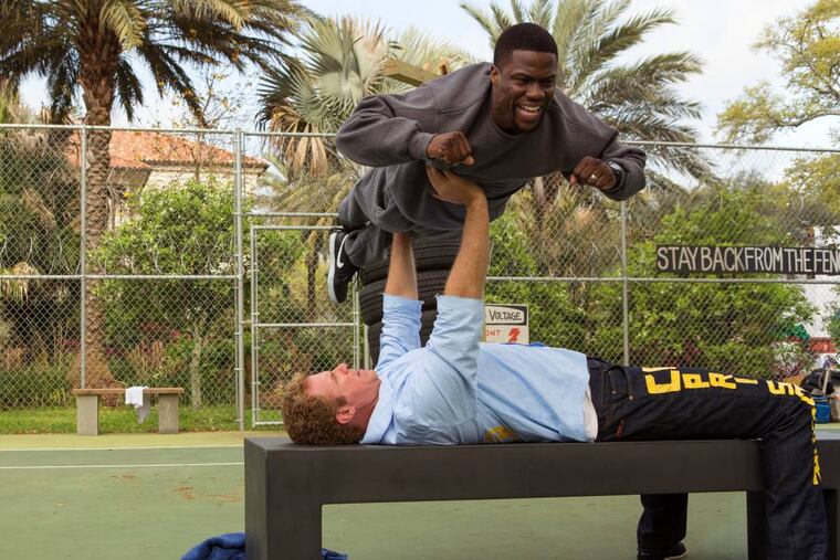 Will Ferrell prepares for prison by bench-pressing Kevin Hart. (AP Photo/Warner Bros. Entertainment Inc., Patti Perret)