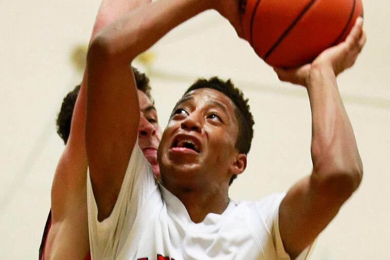 Lenape's Dante Owens-Hill drives to the basket for two of his 21 points in the Indians' win over Palmyra. Owens-Hill also had nine rebounds.