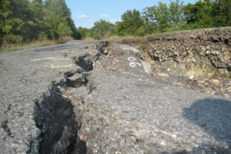 Smoke rises through huge cracks in the town's old main road - no longer used. "Every year, it gets greener and greener," says one resident. "It's basically like living in the countryside now."