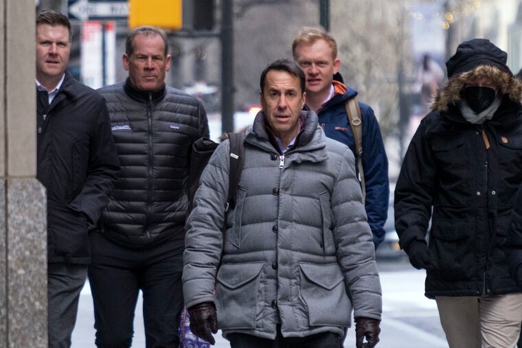 Major League Baseball deputy commissioner Dan Halem, center, arrives for a meeting in New York on Monday for the first in-person baseball negotiating session since the MLB lockout began. At far left is Patrick Houlihan, Senior Vice President & Deputy General Counsel, Labor Relations at Major League Baseball, second from left is Colorado Rockies owner Dick Montfort, and behind Halem is executive vice president Morgan Sword.