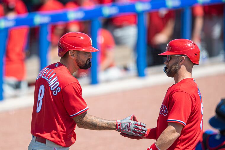 Nick Castellanos congratulates Bryce Harper on his solo home run in the second inning Sunday.
