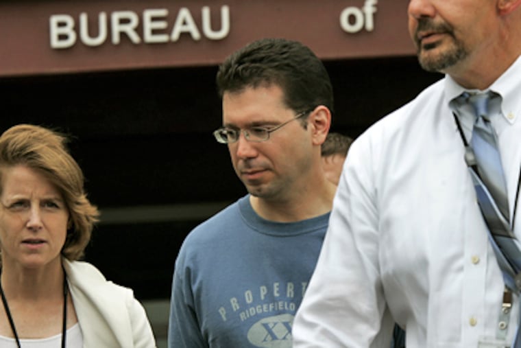 Ridgefield, N.J., Mayor Anthony R. Suarez, center, is walked to a waiting bus outside FBI offices in Newark, N.J. after being arrested earlier today. (AP Photo/Mel Evans)