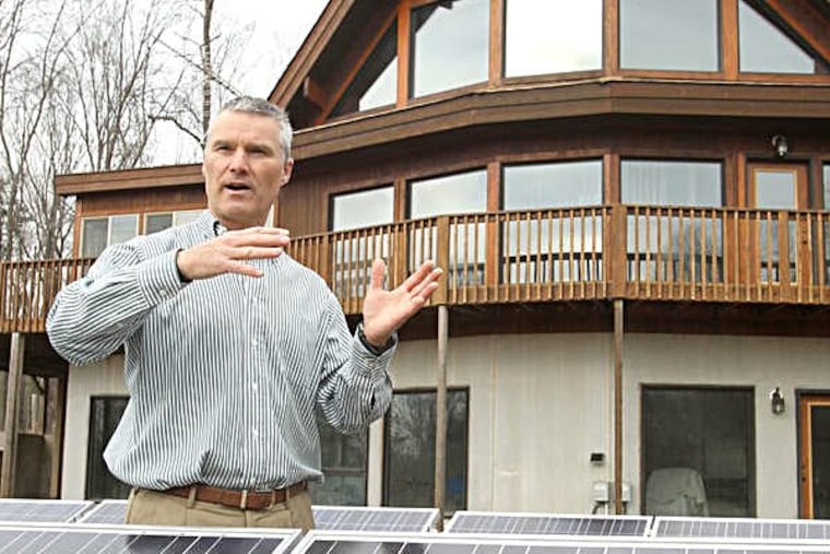 Dante Di Pirro's contemporary house replaces a drafty Cape Cod and serves as a lab and a showcase for energy efficiency. (Charles Fox / Staff Photograhper)
